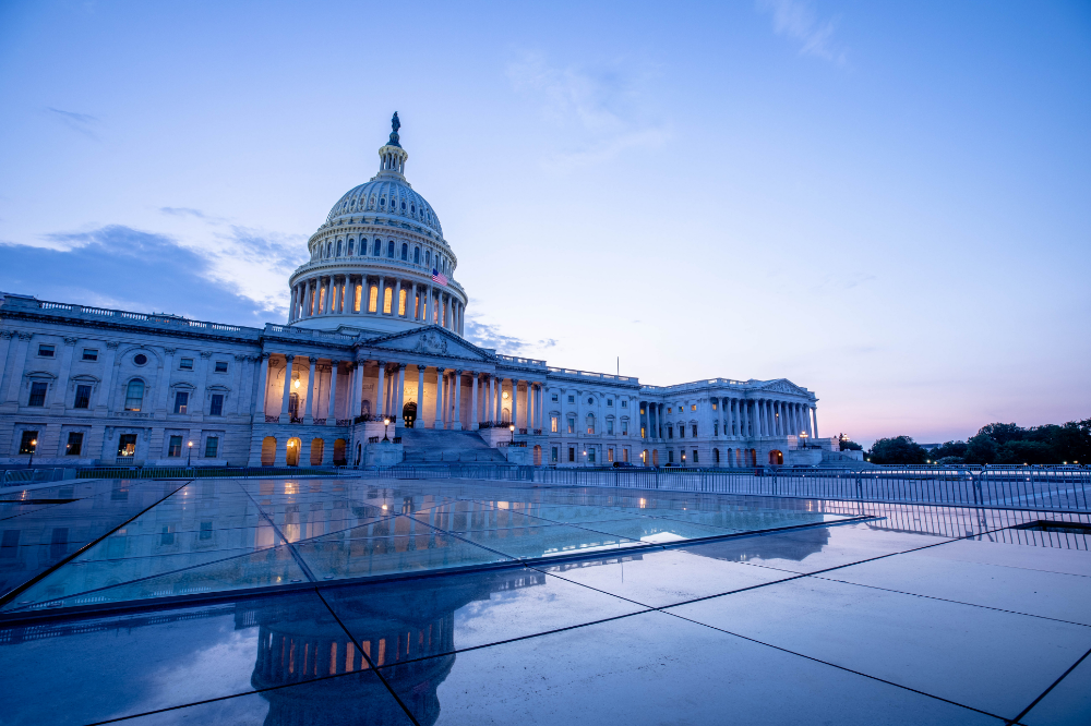 Government building illuminated at sunset, illustrating how businesses can stand out and win federal procurement opportunities.