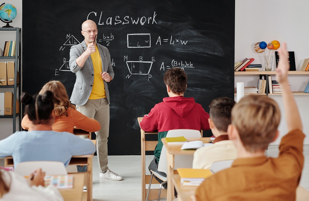 Teacher instructing students in a classroom, symbolizing how Trillium Lakeland District School Board improved procurement through eProcurement.