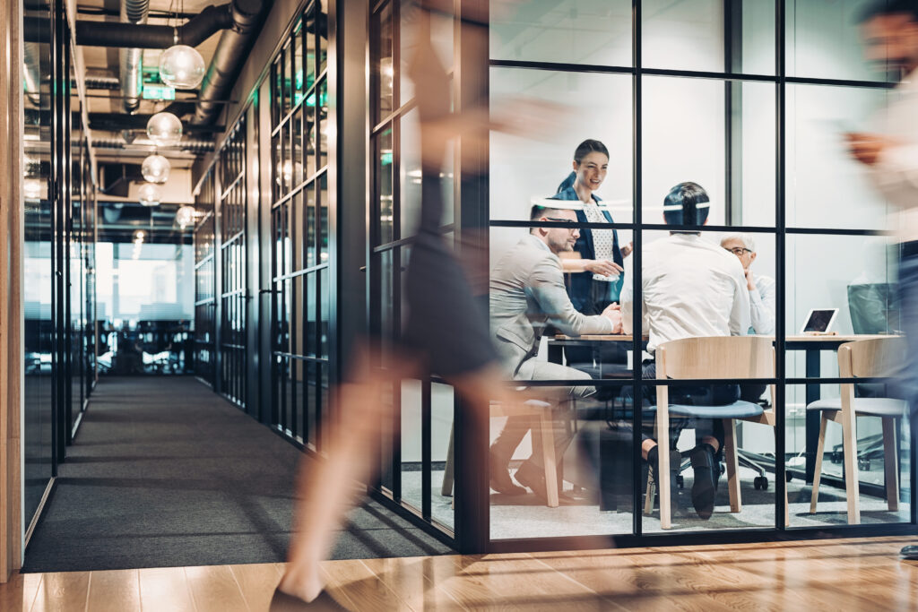 Professional working on a laptop in a modern office, representing organizations evaluating whether to adopt eProcurement solutions.
