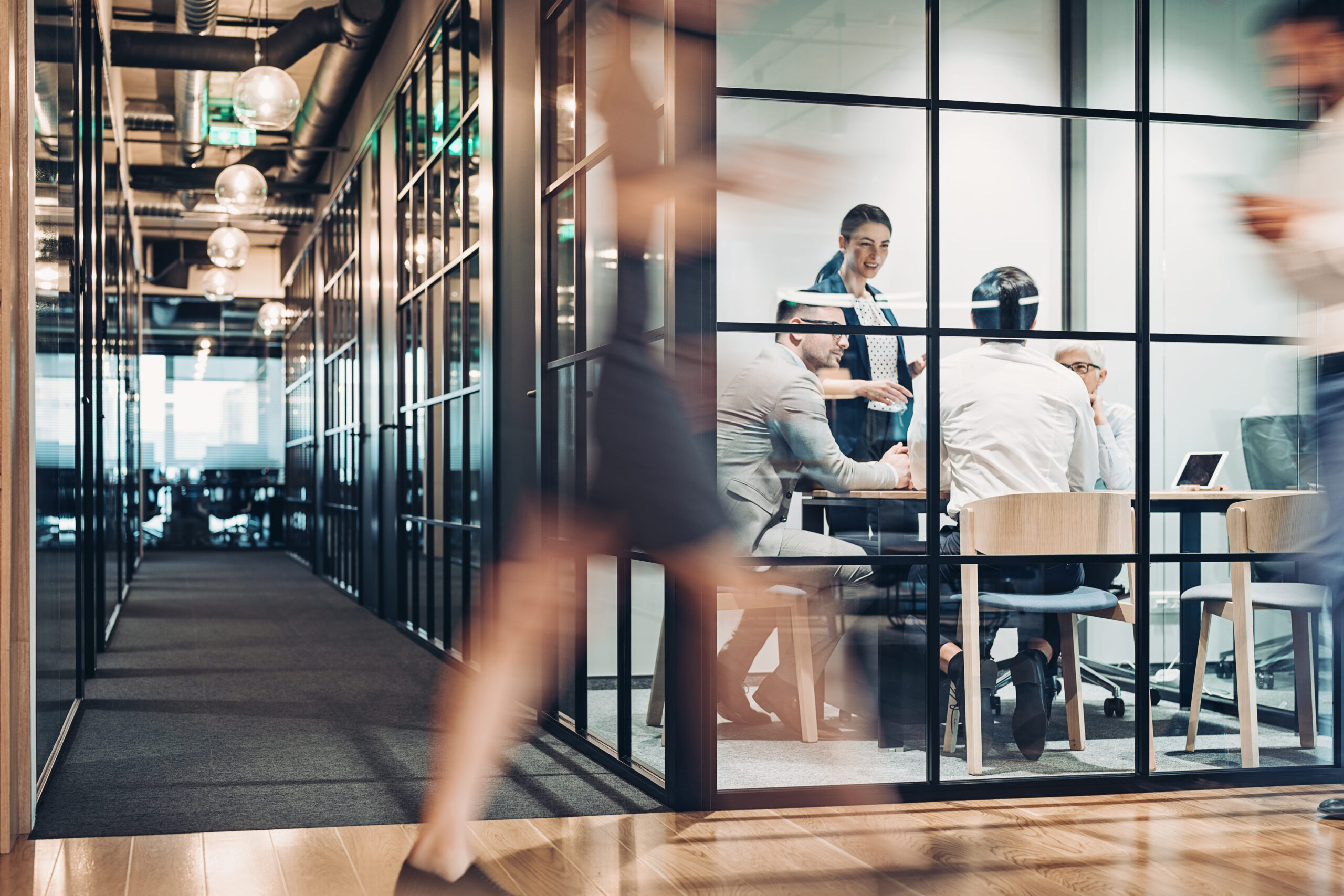 Professional working on a laptop in a modern office, representing organizations evaluating whether to adopt eProcurement solutions.