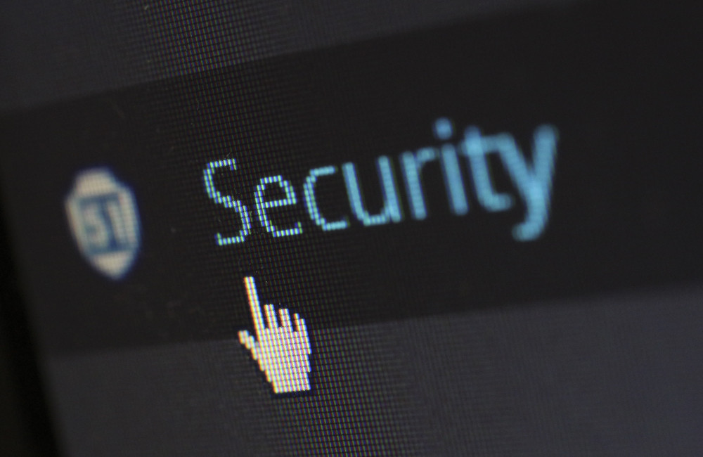 Close-up of a computer screen with a cursor pointing to the word ‘Security,’ symbolizing how digital bonds enhance trust and security in procurement.