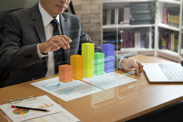 Person analyzing colorful performance charts and data visualizations to monitor supplier performance and improve procurement results.